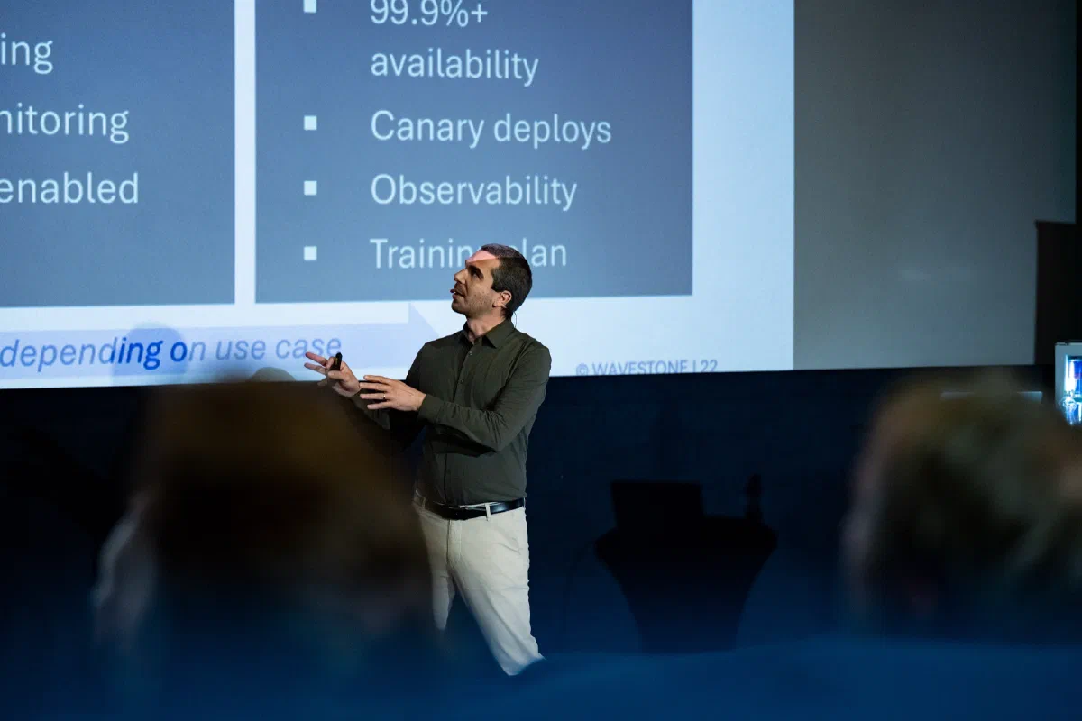 Fabrizio Lazzaretti on stage at Cloud Native Days Austria 2026, presenting the Scaled phase